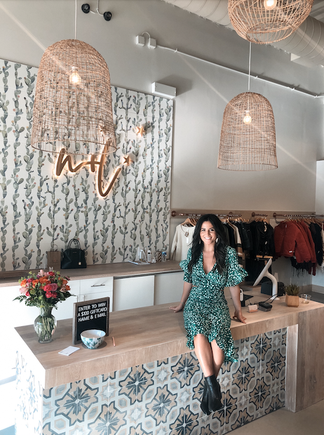 Nina + Leigh Halcyon team at checkout counter inside the Alpharetta boutique