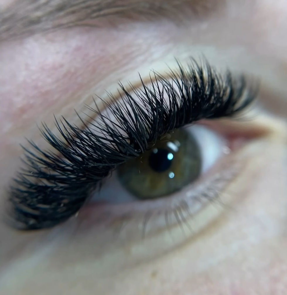 Eye-level view of dramatic volume lash extensions with thick, fluffy appearance