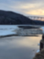 Slightly upriver from the Tripod on the Tanana River, along the dock.