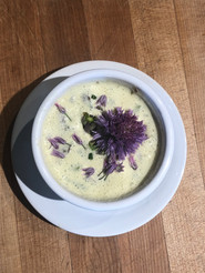 Potato soup with chive flowers