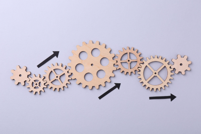 Connected gears representing workflow efficiency and revenue cycle management processes