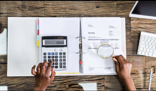 Healthcare revenue and billing analysis with financial documents and calculator