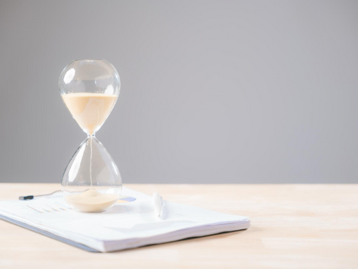 Hourglass representing credentialing delays and reimbursement timelines