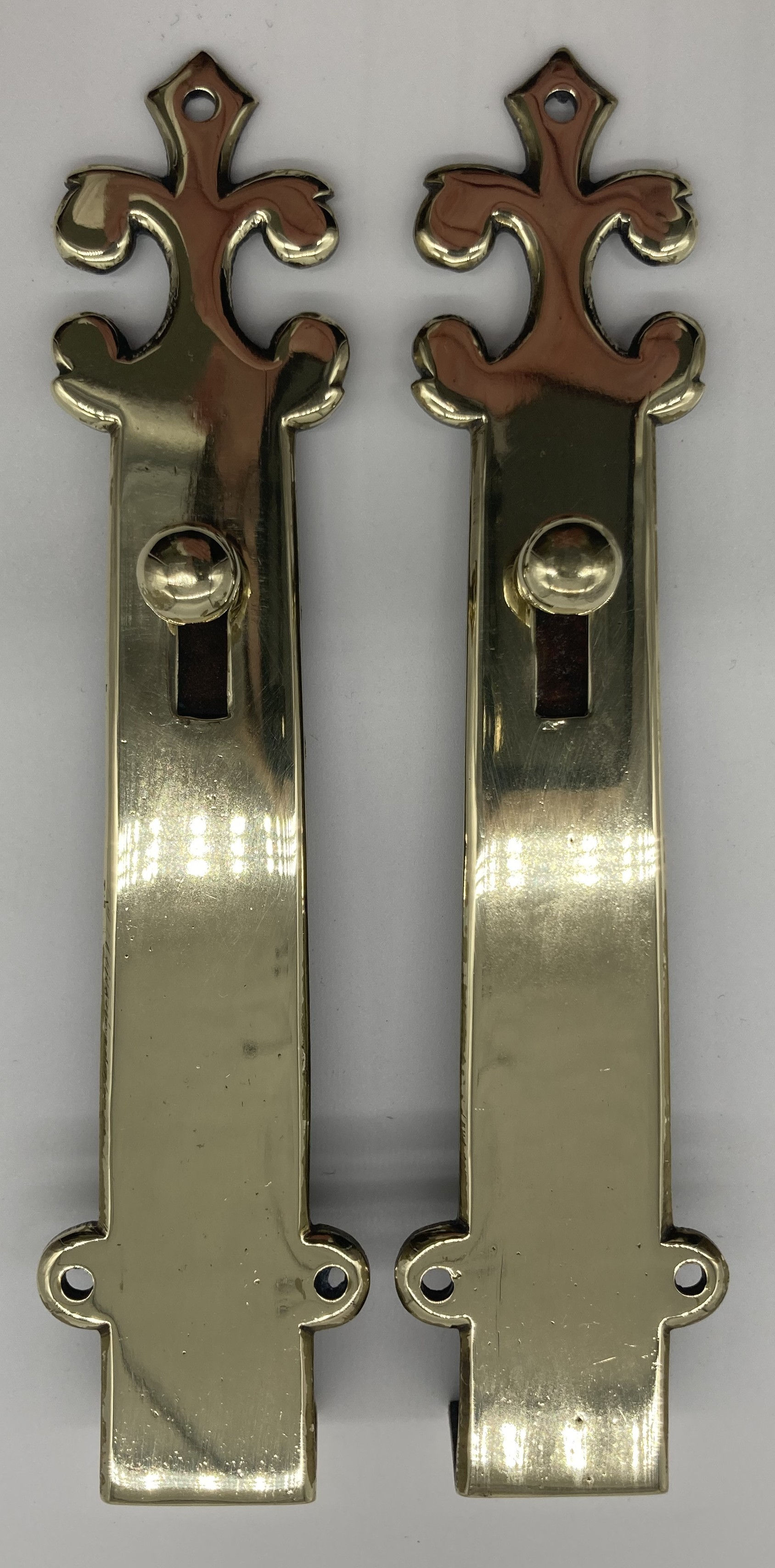 A pair of brass door shut bolts