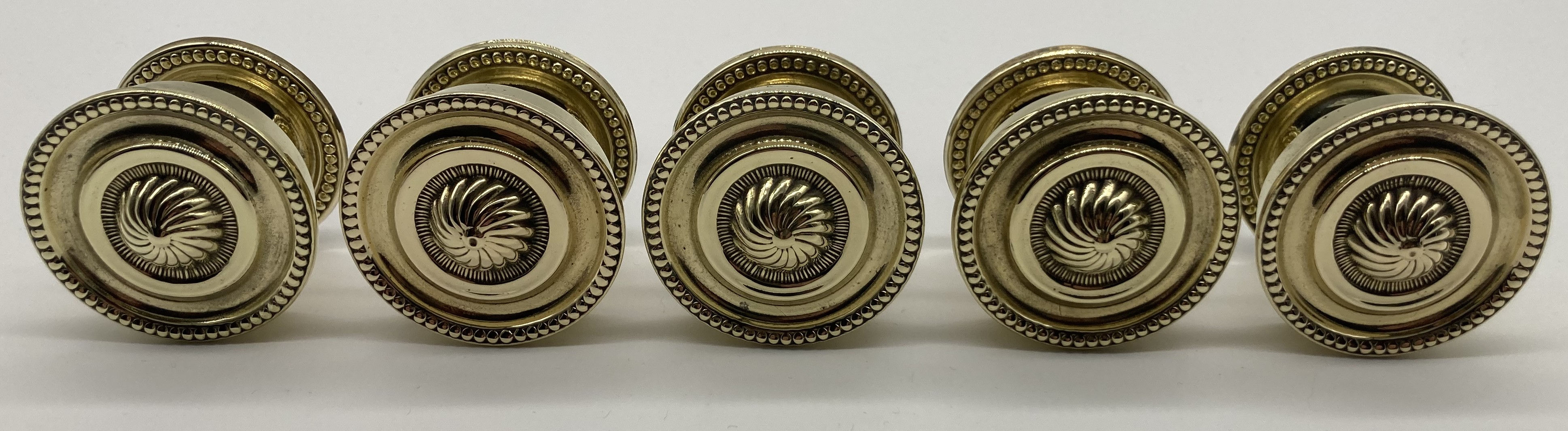 Set of five Georgian style brass cupboard knobs