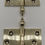 Thumbnail: A pair of brass door hinges