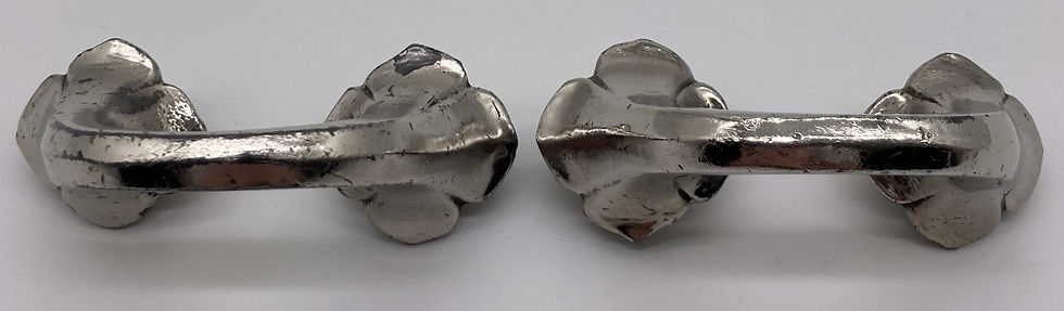 A pair of Edwardian silver plated cupboard handles