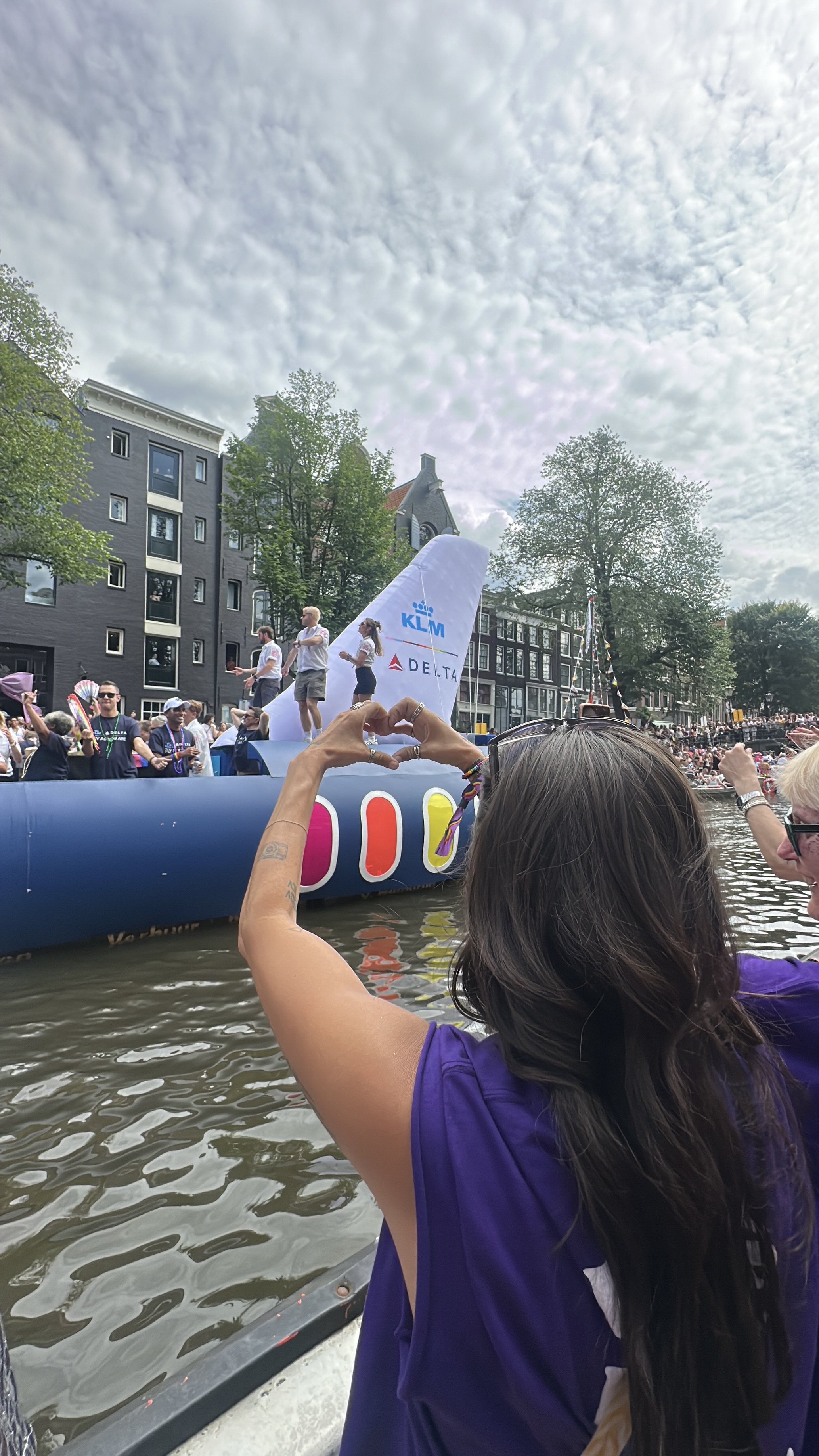 Discover how KLM celebrated WorldPride Amsterdam 2026 through its Pride House, Canal Parade boat, Pride flights and LGBTQI+ inclusion initiatives | She Comes With Baggage Media