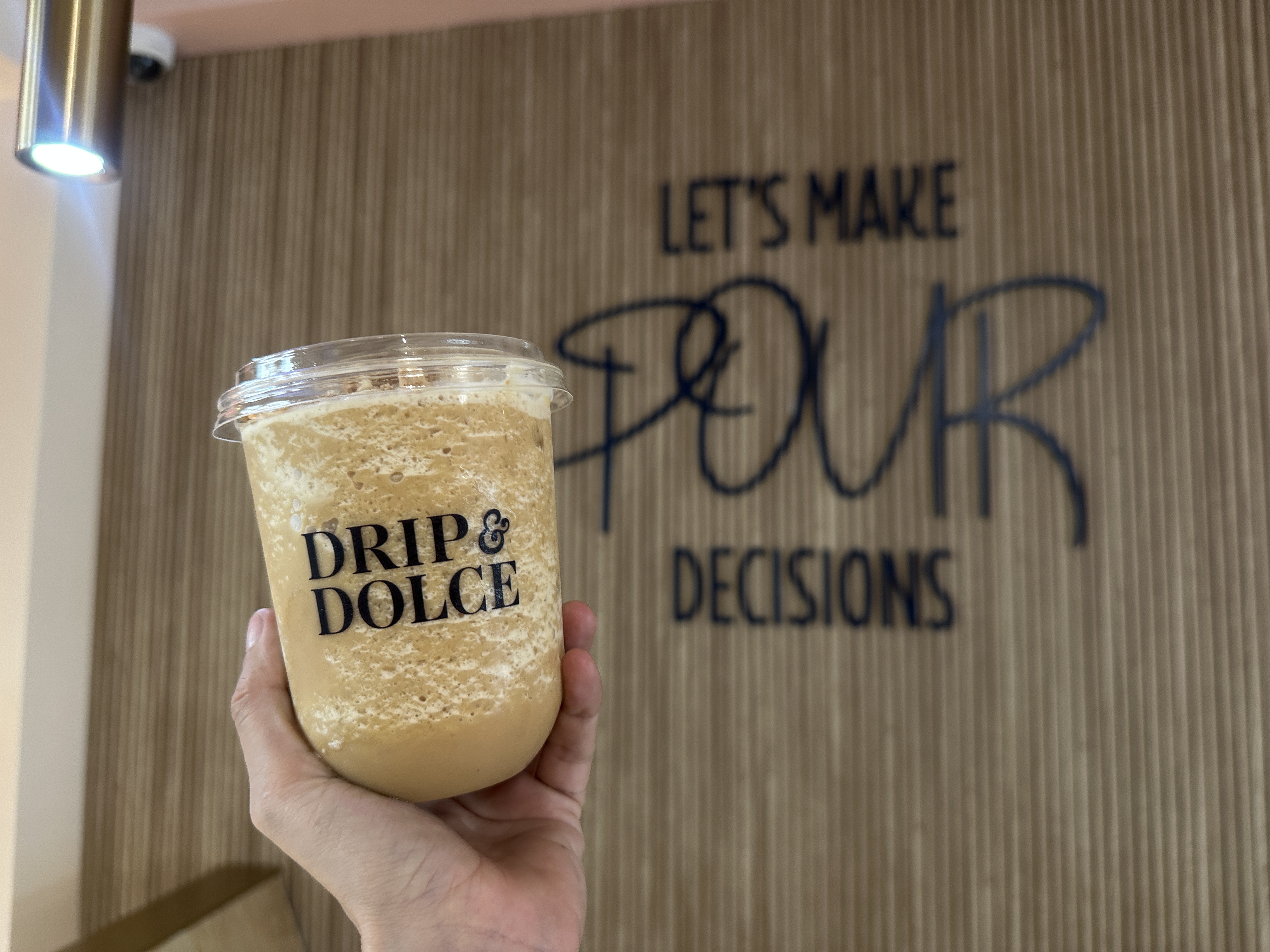 Signature latte at Drip & Dolce, a queer-owned café in West Hollywood, a beautifully presented latte