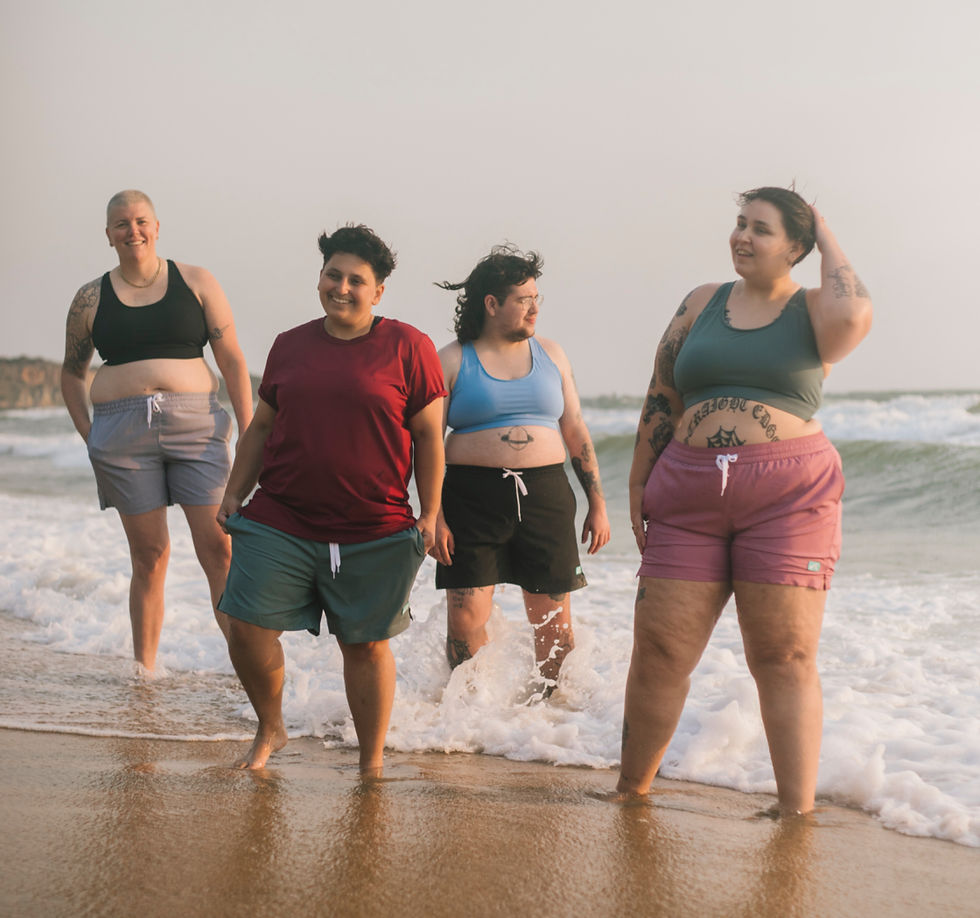 Model wearing Unity Cove gender-inclusive swimwear designed for comfort, coverage, and everyday movement | She Comes With Baggage Media