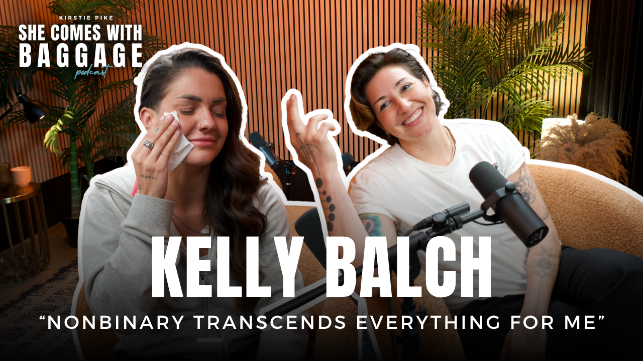 Portrait of Kelly Balch smiling, representing queer identity and resilience on She Comes With Baggage Podcast