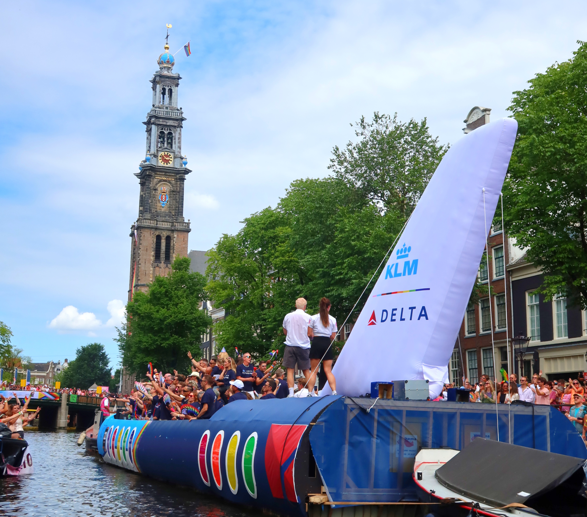 Discover how KLM celebrated WorldPride Amsterdam 2026 through its Pride House, Canal Parade boat, Pride flights and LGBTQI+ inclusion initiatives | She Comes With Baggage Media