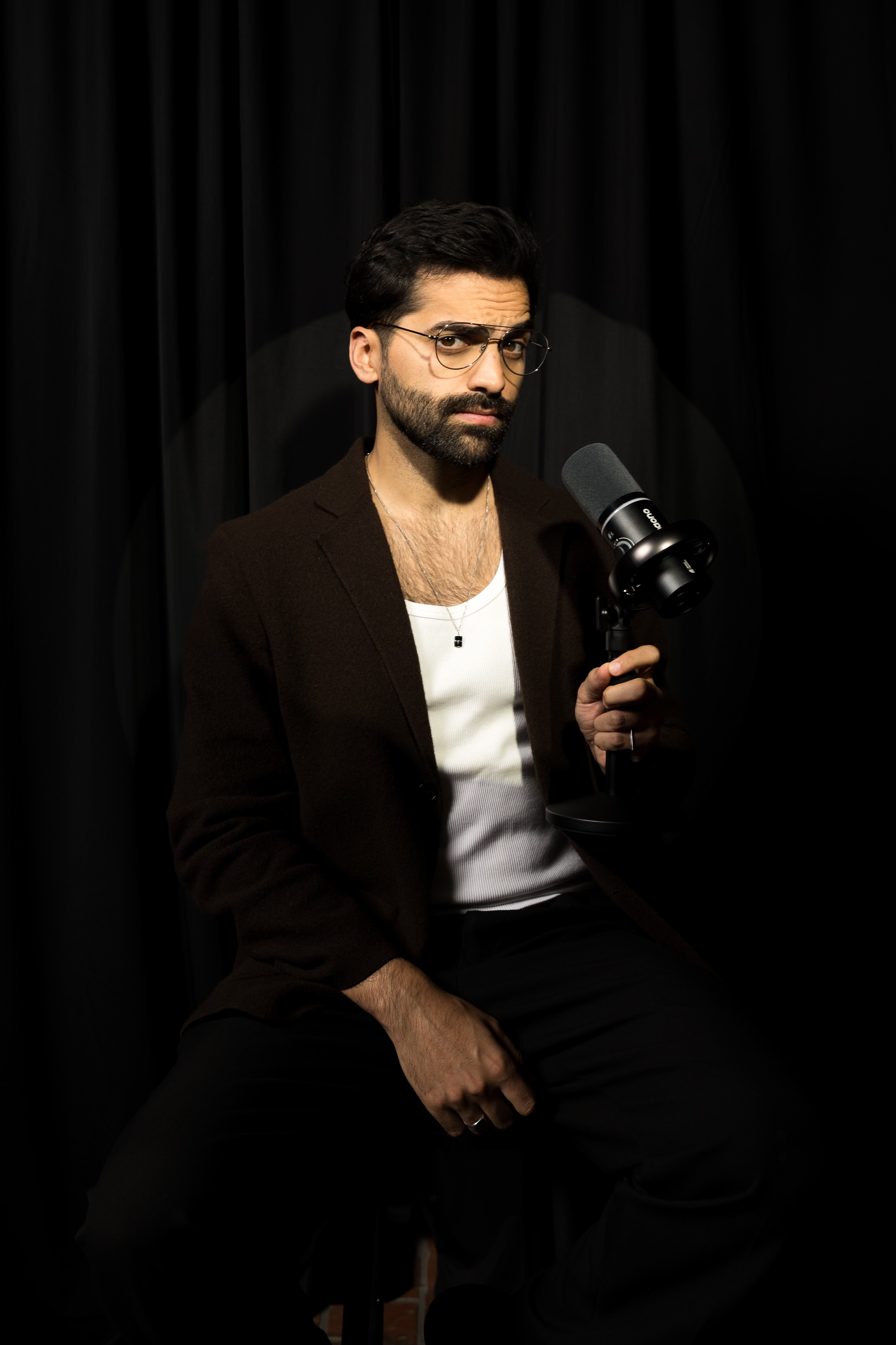 Andy Lalwani celebrity interviewer LGBTQ journalist entertainment media and host of Culture Shock Podcast | She Comes With Baggage Media