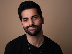 Andy Lalwani celebrity interviewer LGBTQ journalist entertainment media and host of Culture Shock Podcast | She Comes With Baggage Media
