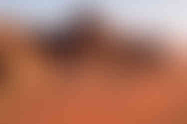 Portrait of Kirstie Nicole, award-winning content creator and founder of The Collective, developing She Comes With Baggage Media projects and hosting the She Comes With Baggage podcast. Award-Winning Travel Content with Kirstie's Drone Flying Skills in Jordan