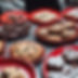 close up of loaded brownies, chocolate chip cookies, and scones, on red plates in a crowde