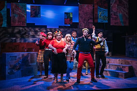 Ensemble of Merrily we Roll Along dancing
