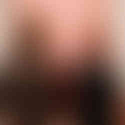 Two parents sharing a joyful moment at REAL Impact Night 2025 at Brody House.