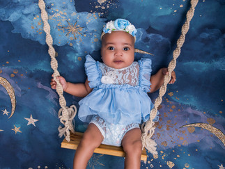 Baby girl swing setup milestone photoshoot with blue backdrop Singapore