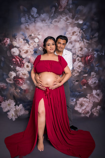 Maternity photoshoot Singapore elegant red gown studio pregnancy portrait