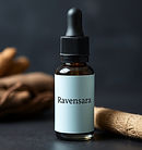Ravensara essential oil bottle with dropper and only the word Ravensara written on the bot