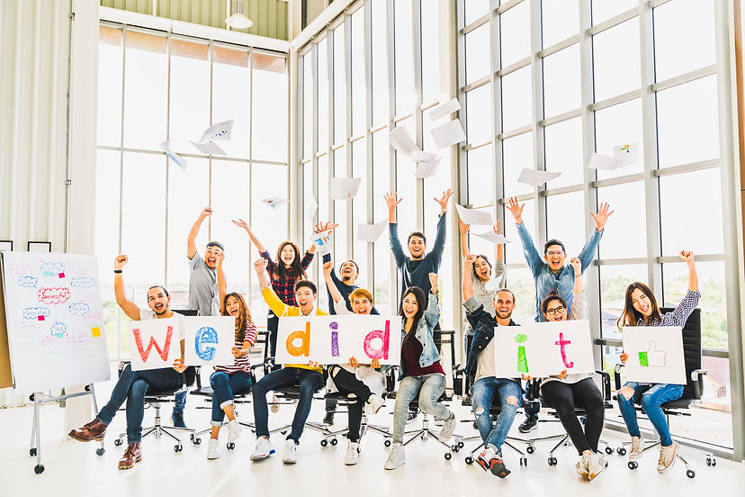 Multiethnic diverse group of happy business people cheering together, celebrate project su