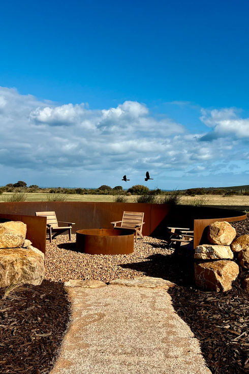 Rural garden and landscape architecture in the south west - outdoor fireplace and steel retaining 