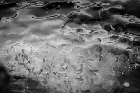 Black and white abstract texture with fluid patterns.