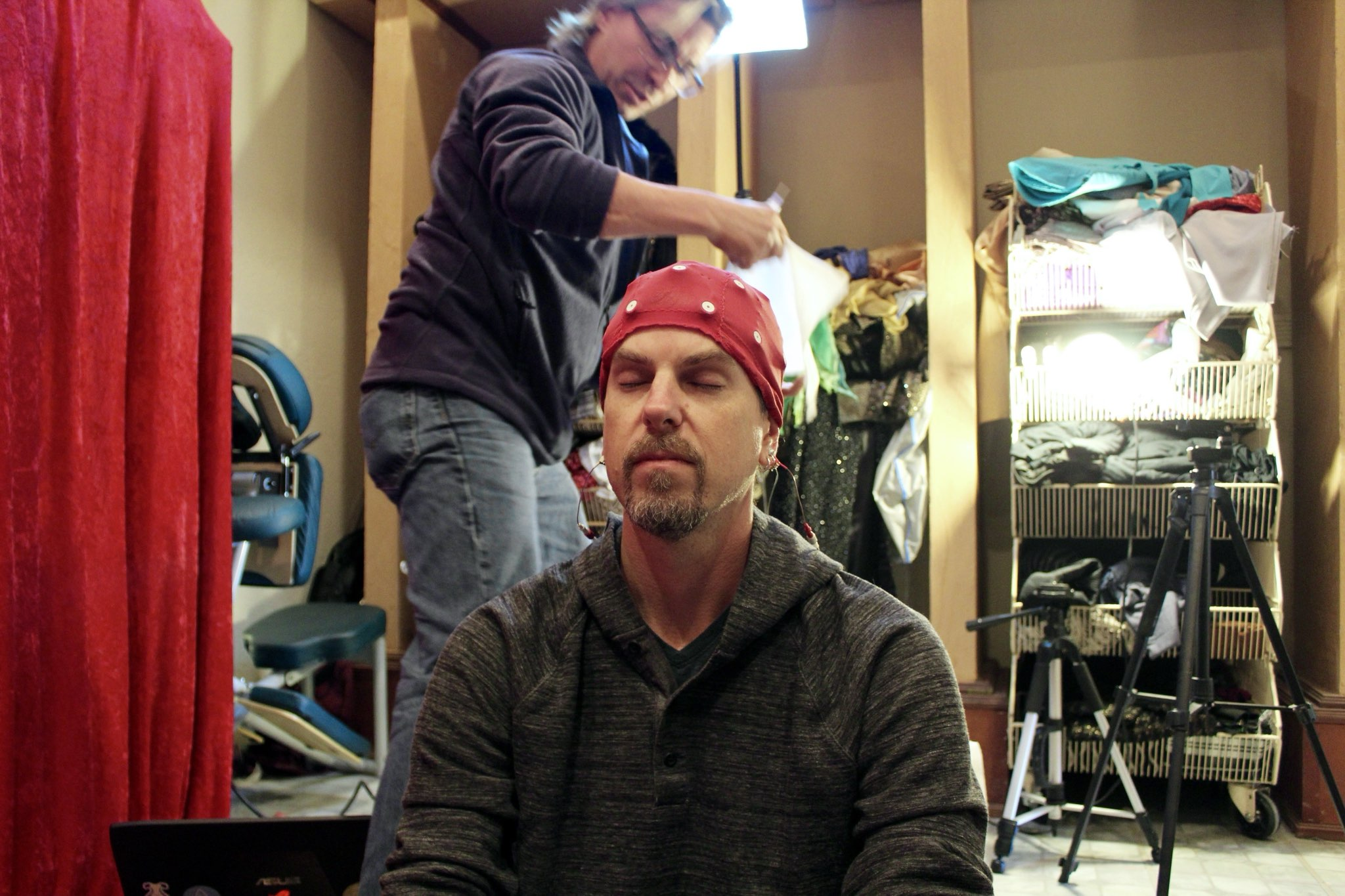 Martin Ball with EEG cap, Jeff Tarrant preparing equipment