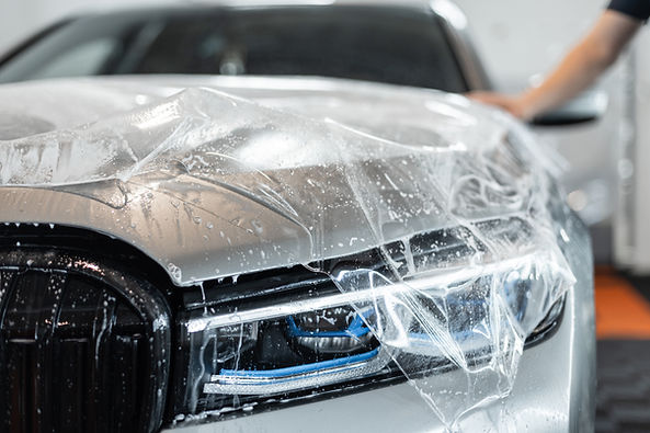 beautiful-car-with-optics-headlight-wrapping-hood-with-protective-film-detailing-service-p