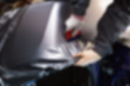 car-wrapping-specialist-putting-vinyl-foil-film-car-selective-focus (3)_edited.jpg