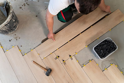 top-view-man-tiling-floor (1).jpg