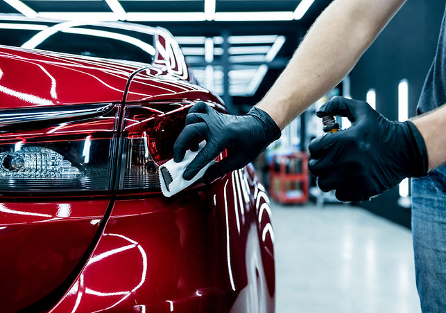 car-service-worker-applying-nano-coating-car-detail.jpg