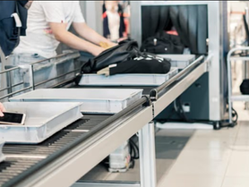 bags being inspected at the airport