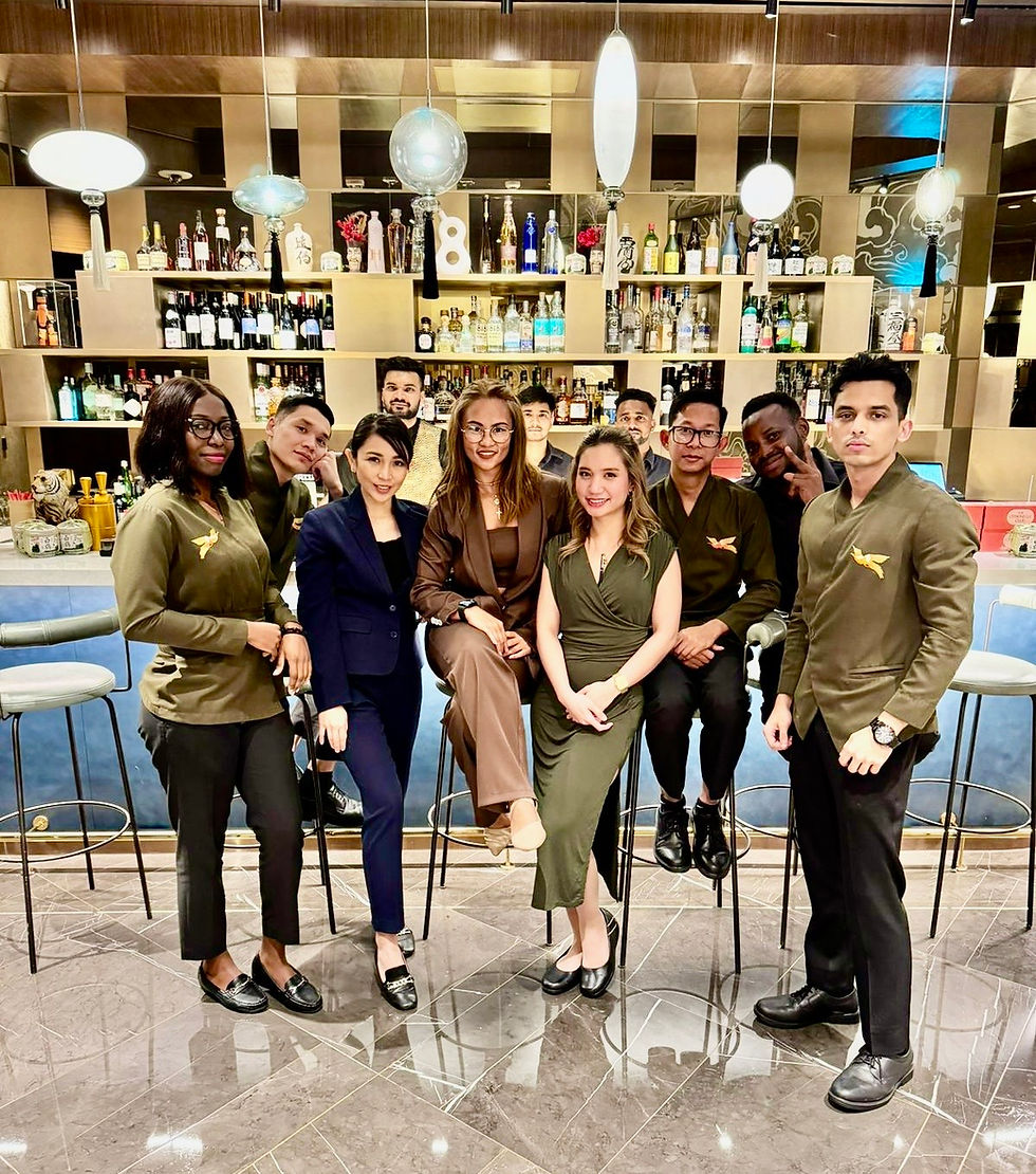 Lora Gregorio with her colleagues at SO/Uptown Hotel's mixology bar