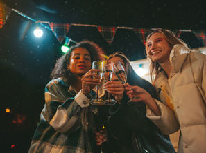 Women toasting with wine at Christmas