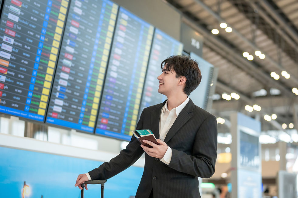 A man looking at flight schedules to Thailan