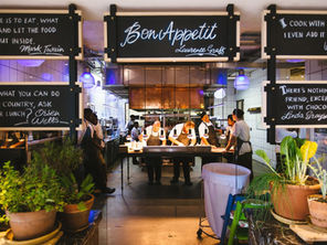 Chefs preparing food together in their kitchen