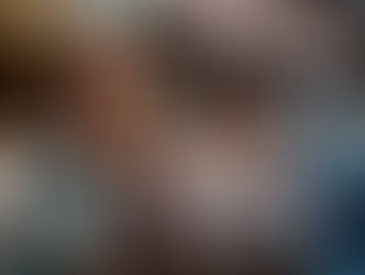 An Asian woman holding a glass of wine