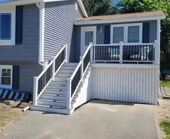 Pressure-treated wood and cedar deck, stairway, and railing construction in Waltham MA