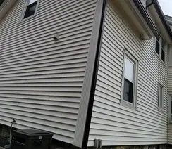 James Hardie siding and aluminum seamless gutter installation by siding contractor in Topsfield, MA.