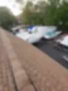 Asphalt roof replacement by commercial roofing contractor in Dracut, Middlesex County, MA.