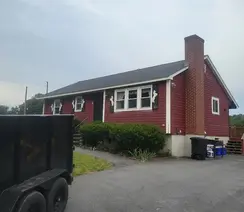 Roof replacement and vinyl siding installation by roofing contractor in Melrose, MA.