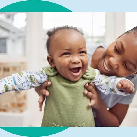 A joyful baby first wobbly steps are a source of pride for many parents