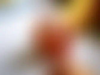 UK special needs school classroom with a teacher assisting a pupil with autism