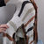 Thumbnail: Upcycled Black White Orange Sweater Poncho Handknotted Fringe