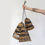 Thumbnail: Set of 3 handwoven banana leaf lamp shades with black accents.