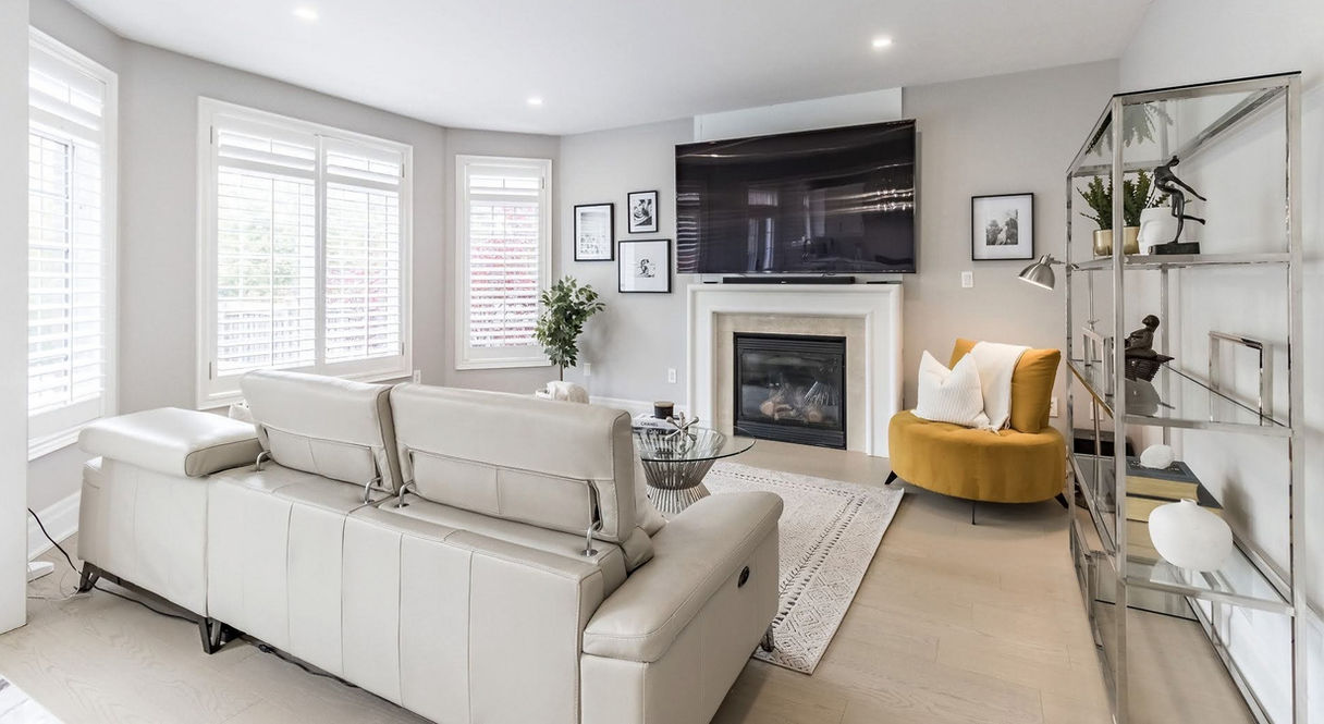Elegant living room staging in Burlington, showcasing modern decor and a welcoming atmosphere for a quick home sale.
