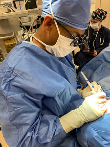 Dr T performing eyelid surgery