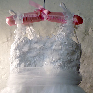 Baby girl's flower dress close-up